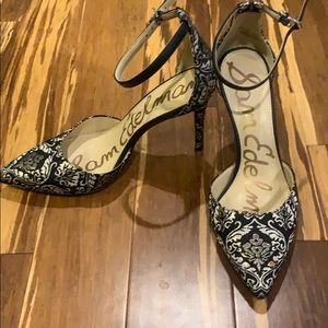 Black fabric with gold detailing heels